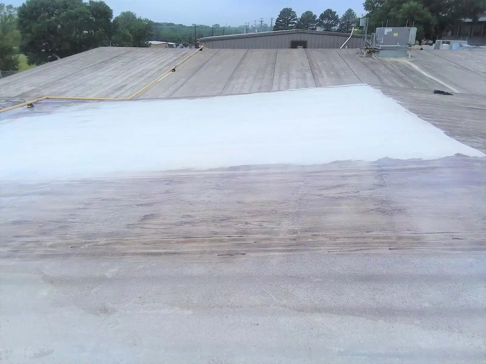 Commercial roof coating restoration